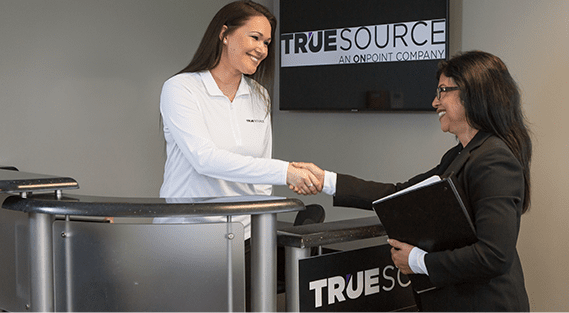 truesource representative shaking hands with a client